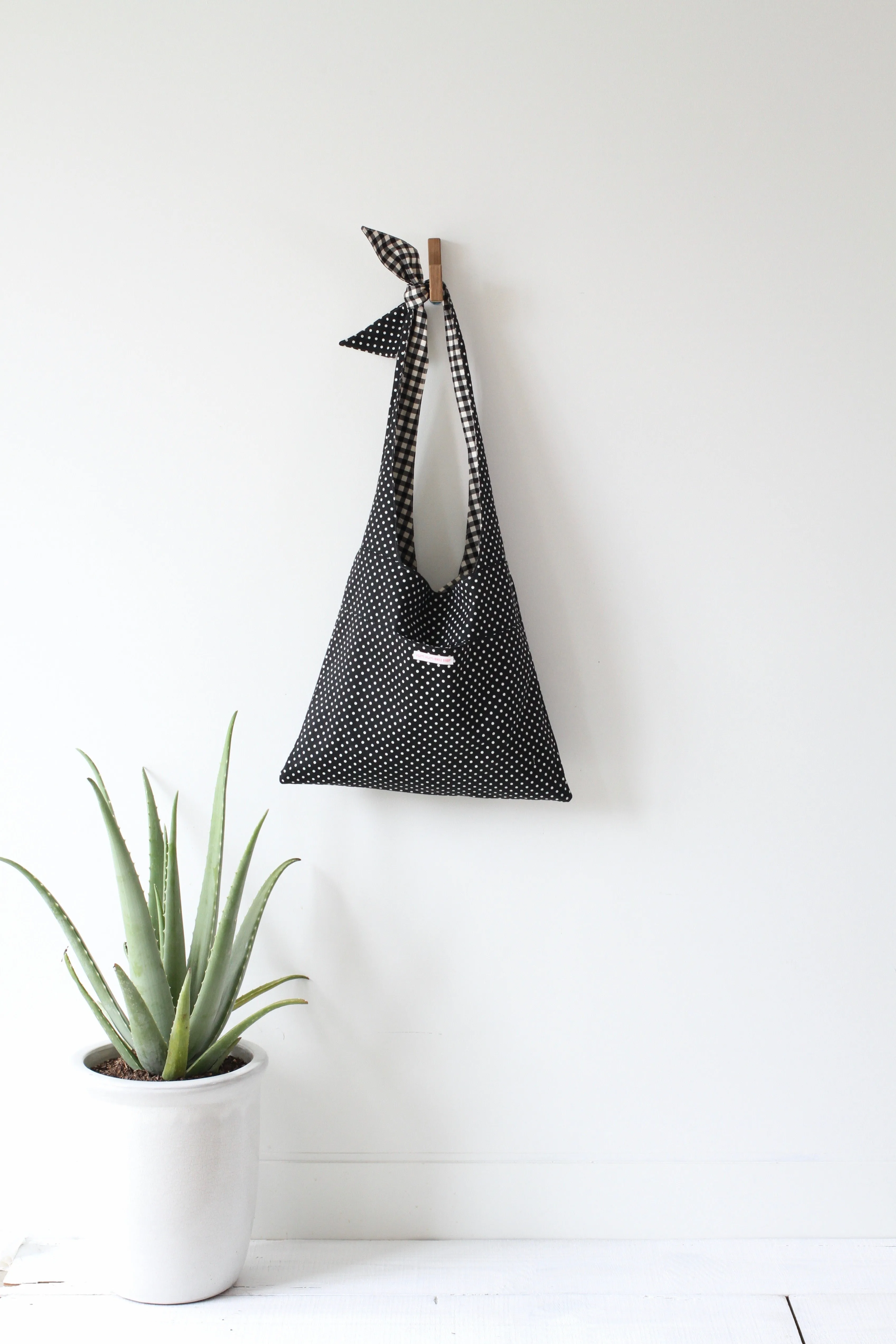 LYCEE TIE TOP REVERSIBLE BAG IN BLACK