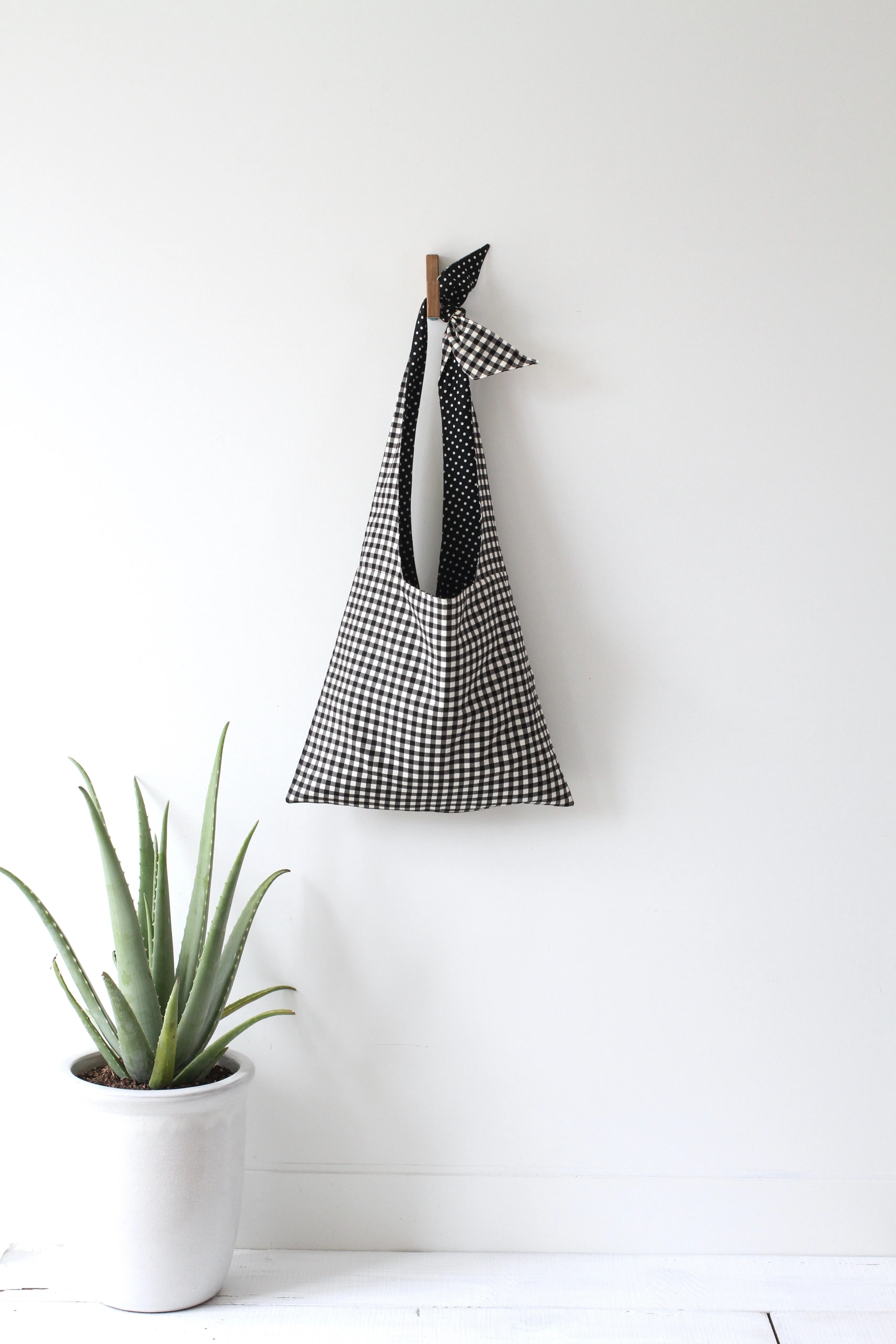 LYCEE TIE TOP REVERSIBLE BAG IN BLACK