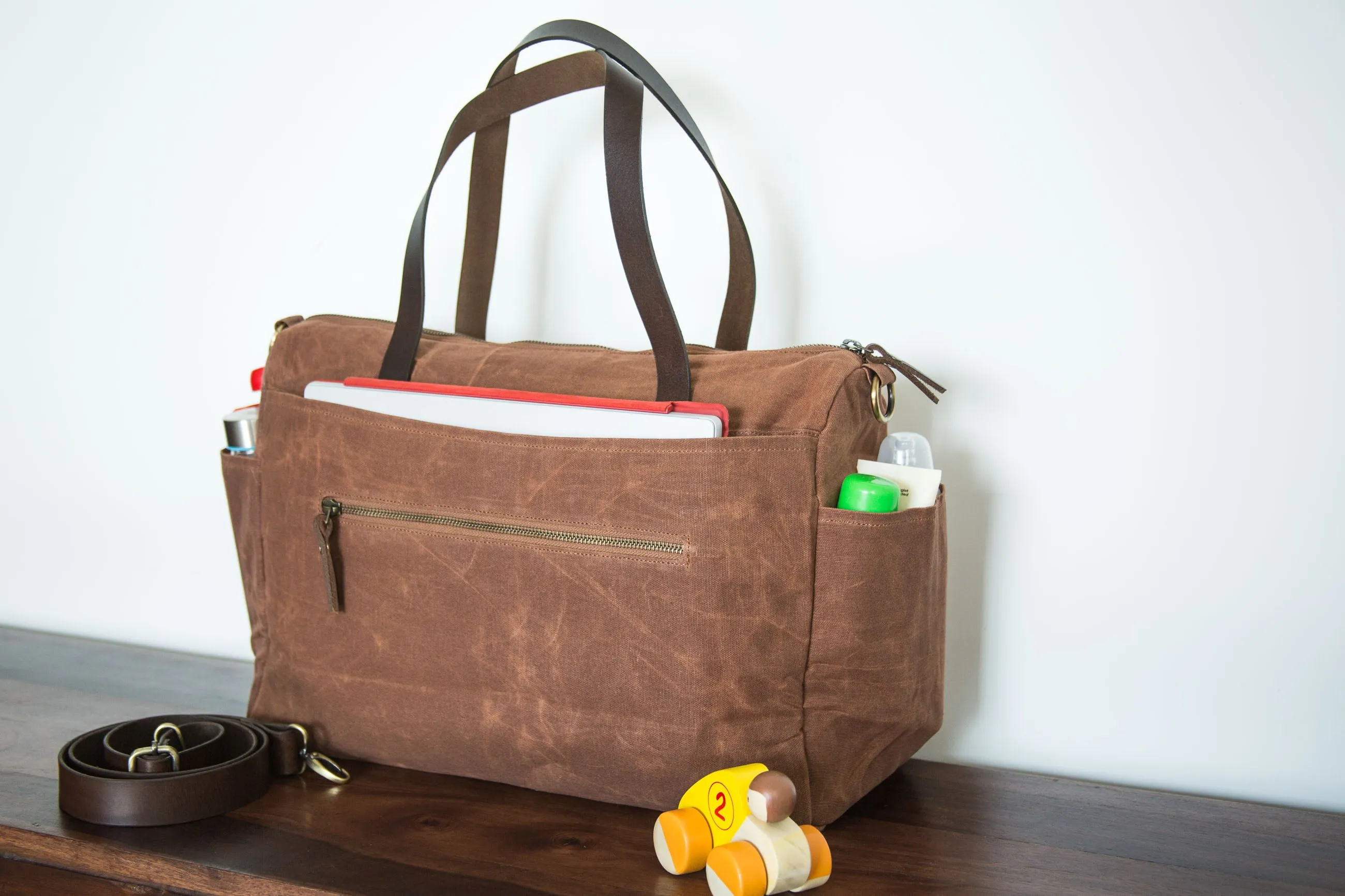 Pipa 11 Pocket Crossbody Diaper Bag Tote in Forest Green | Waxed Canvas & Leather