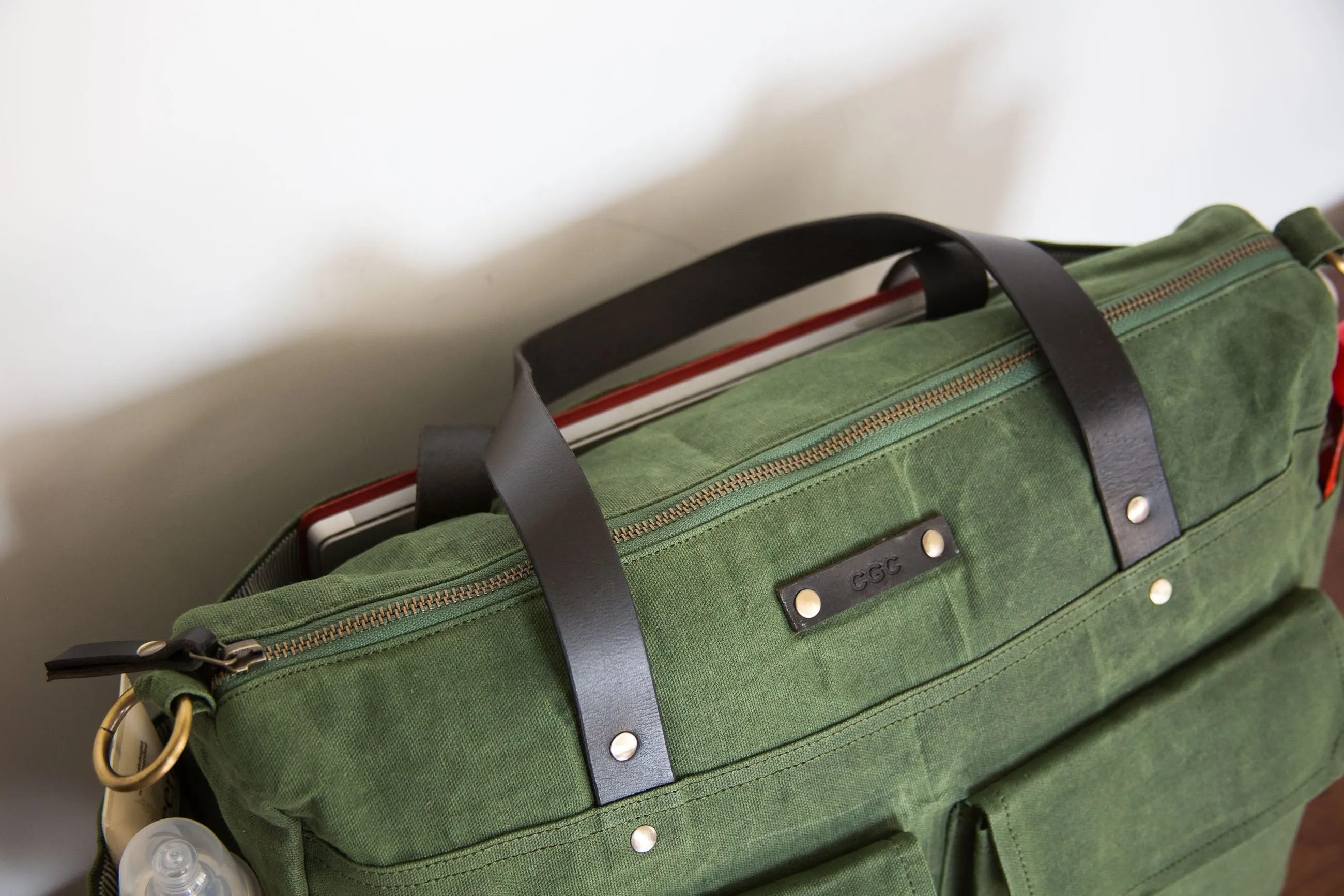 Pipa 11 Pocket Crossbody Diaper Bag Tote in Forest Green | Waxed Canvas & Leather