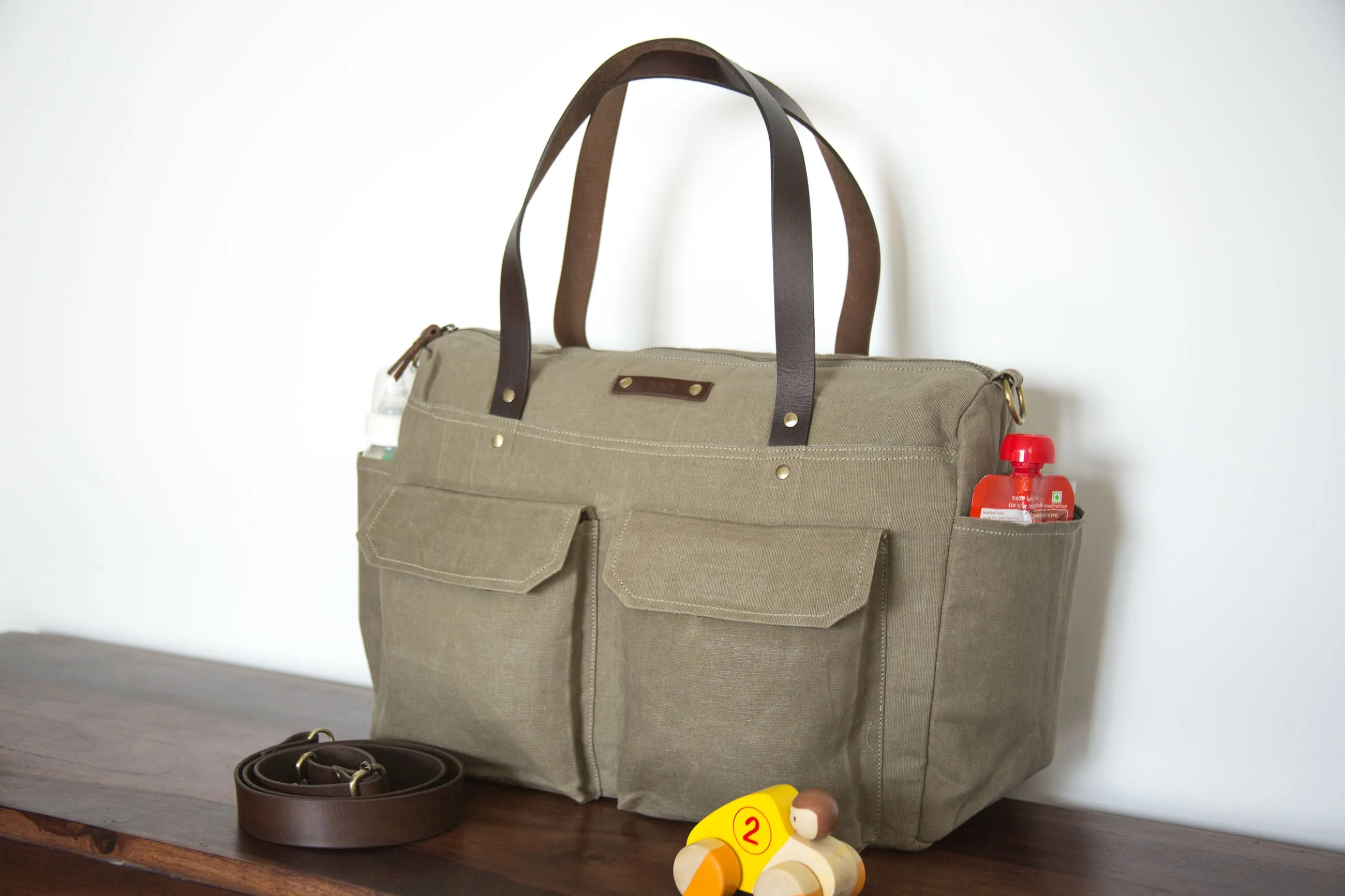 Pipa 11 Pocket Crossbody Diaper Bag Tote in Khaki | Waxed Canvas & Leather
