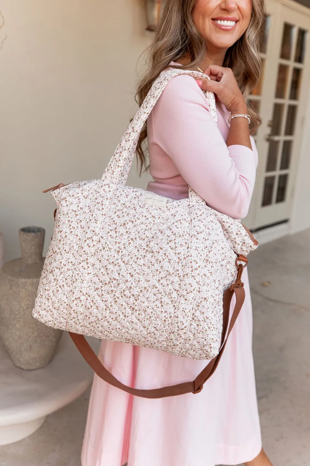 the QUILTED BON VOYAGE DUFFLE Brown Floral